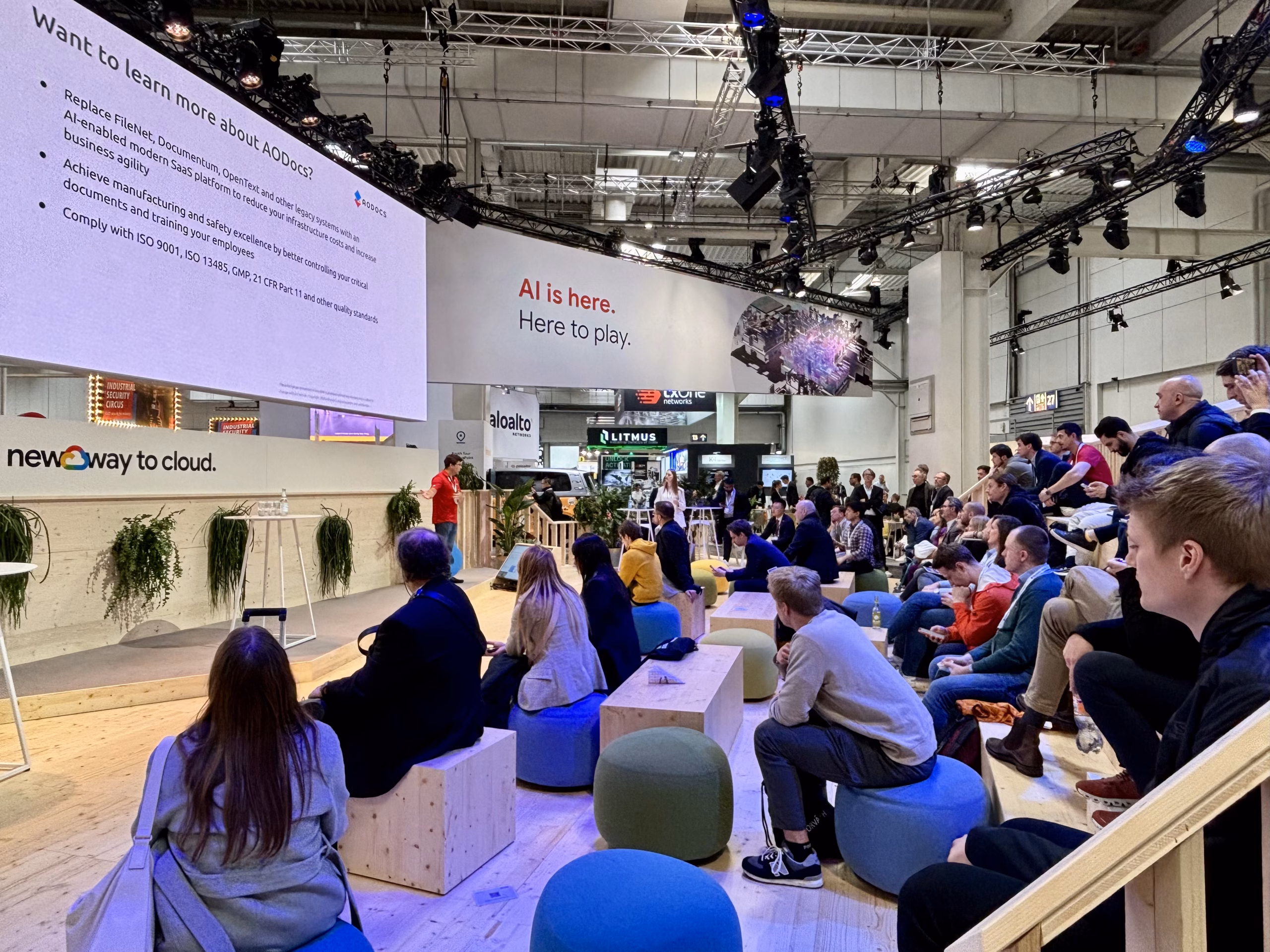 The CEO of AODocs showcasing Gen AI product features for Document, Information and Enterprise Content Management at a tech and manufacturing industry conference in Germany
